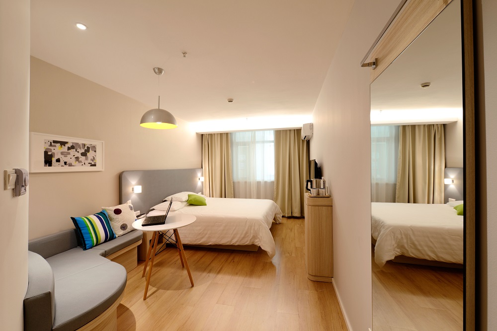 Bedroom with Light Brown Vinyl Plank Flooring