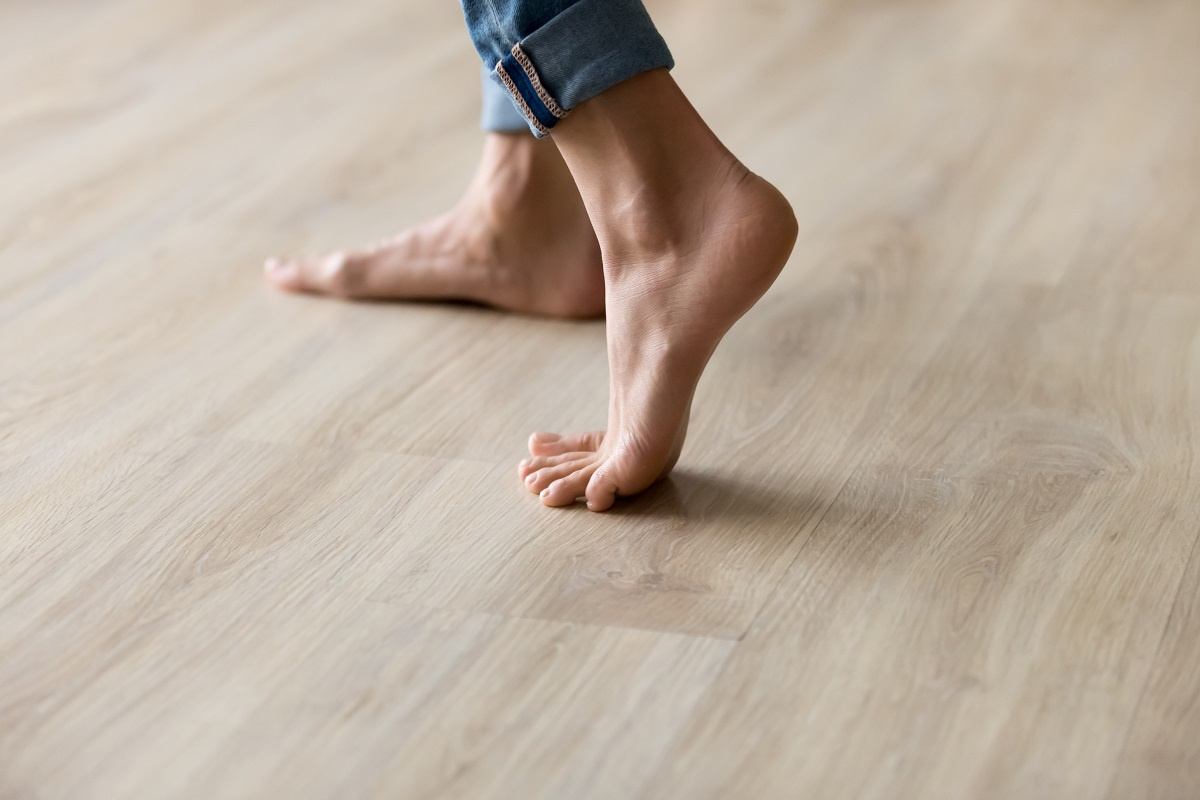 Woman standing on hardwood floor