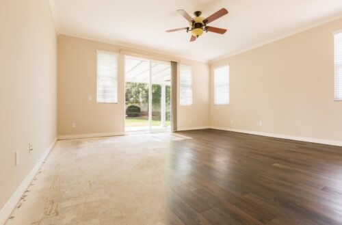 recently upgraded room with refinished hardwood floors and natural lighting from windows