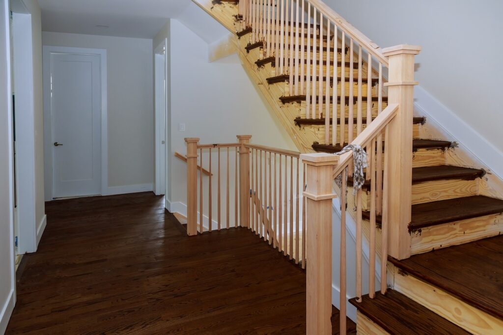 main living room and stairs with recent dark brown hardwood floor installation