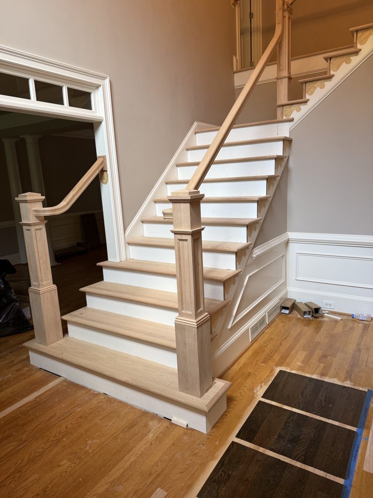 Staircase refinishing in a two-story Alpharetta, GA foyer by Atlanta Floor One