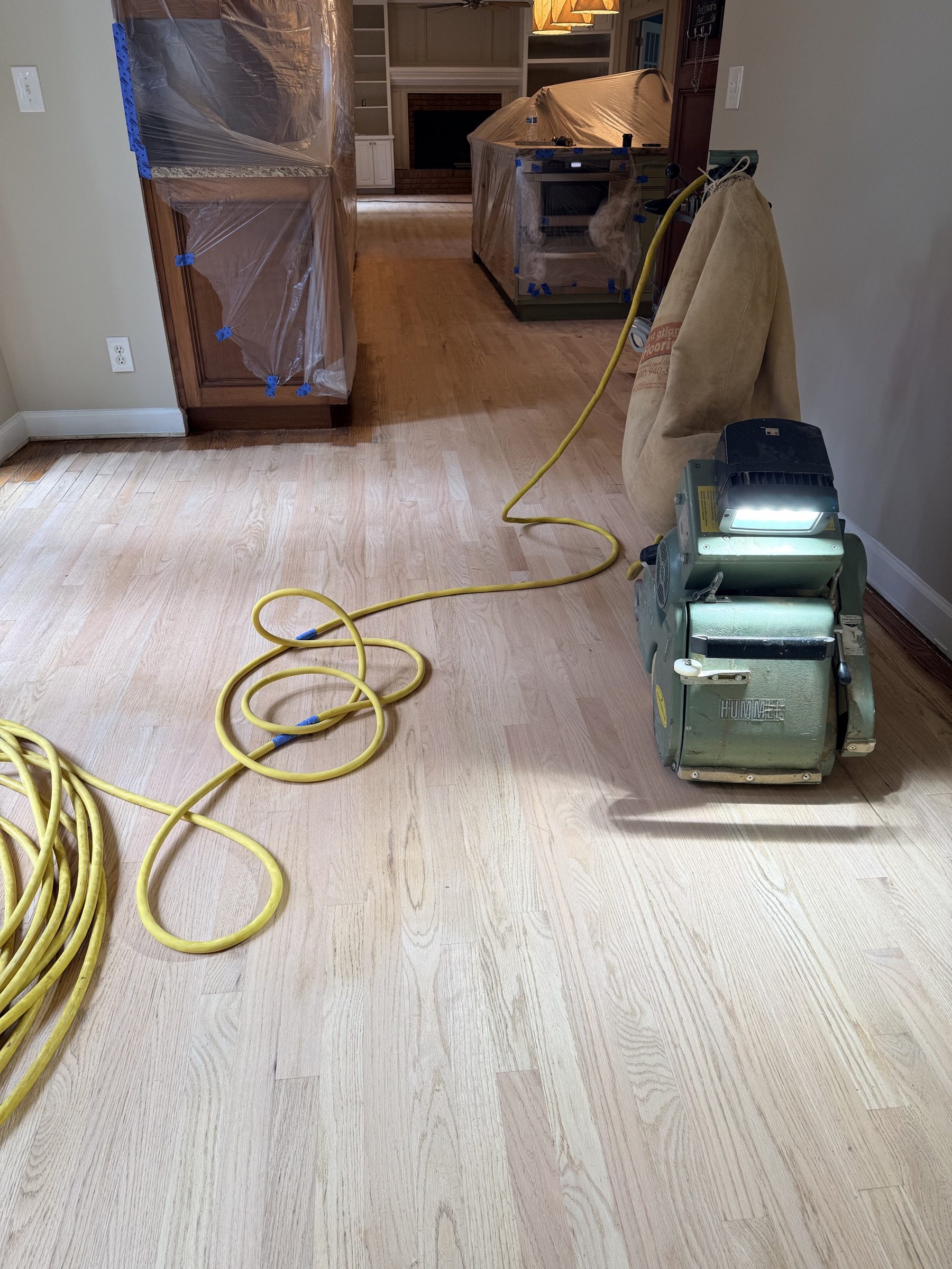 Drum sanding a hardwood floor in the Duluth, GA area by Atlanta Floor One