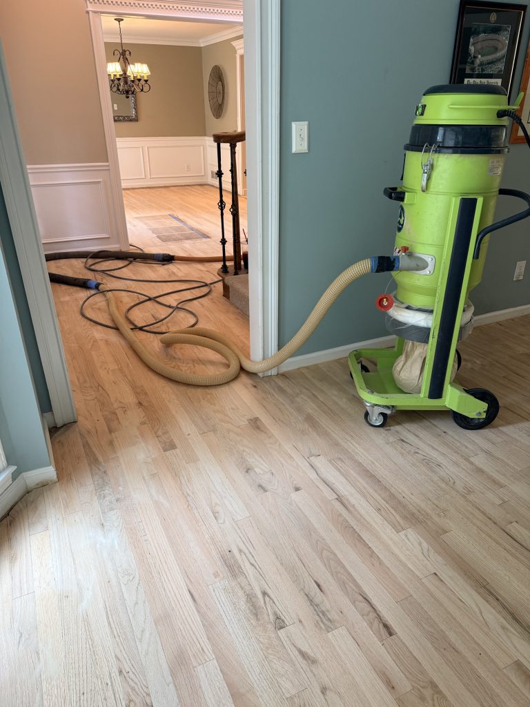 Drum sanding a hardwood floor in the Duluth, GA area by Atlanta Floor One