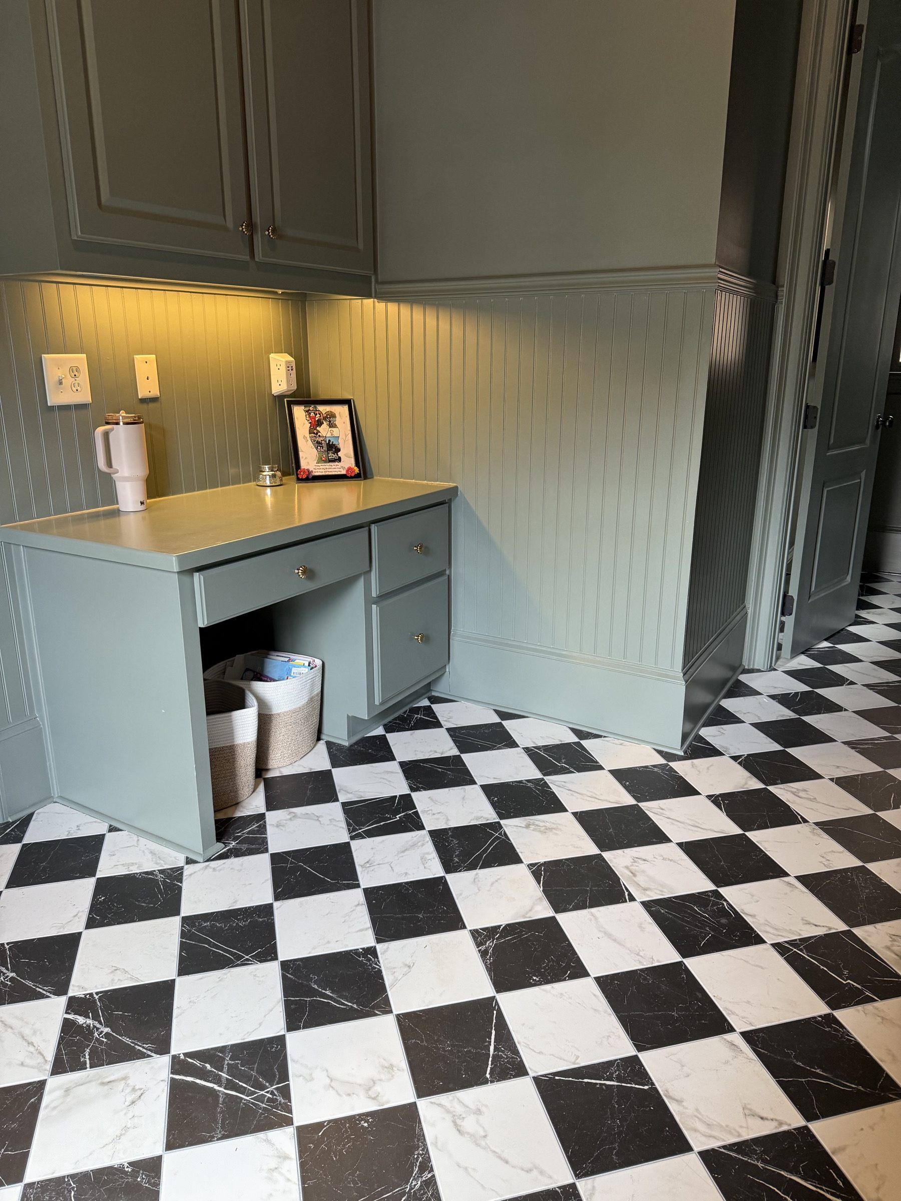 Finished black and white checkerboard tile floor in a Milton, GA home by Atlanta Floor One