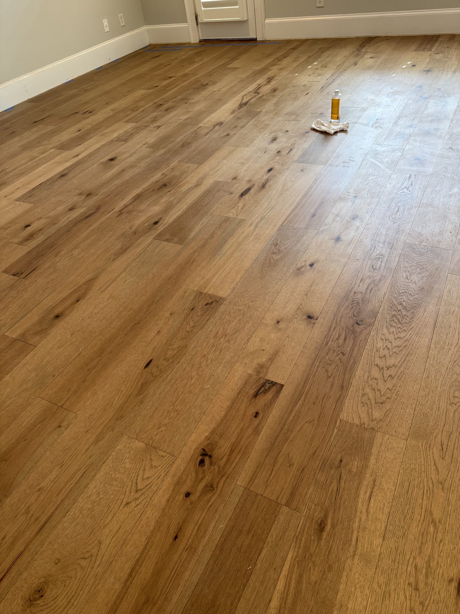 Wide plank white oak hardwood floor installation by Atlanta Floor One